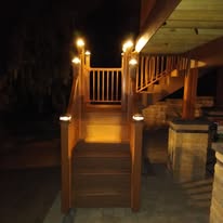 Deck with professional step lighting at night - Belleville IL