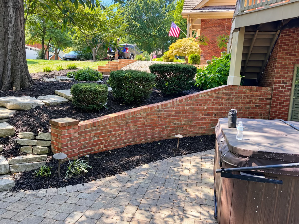 Brick retaining wall and landscaped patio