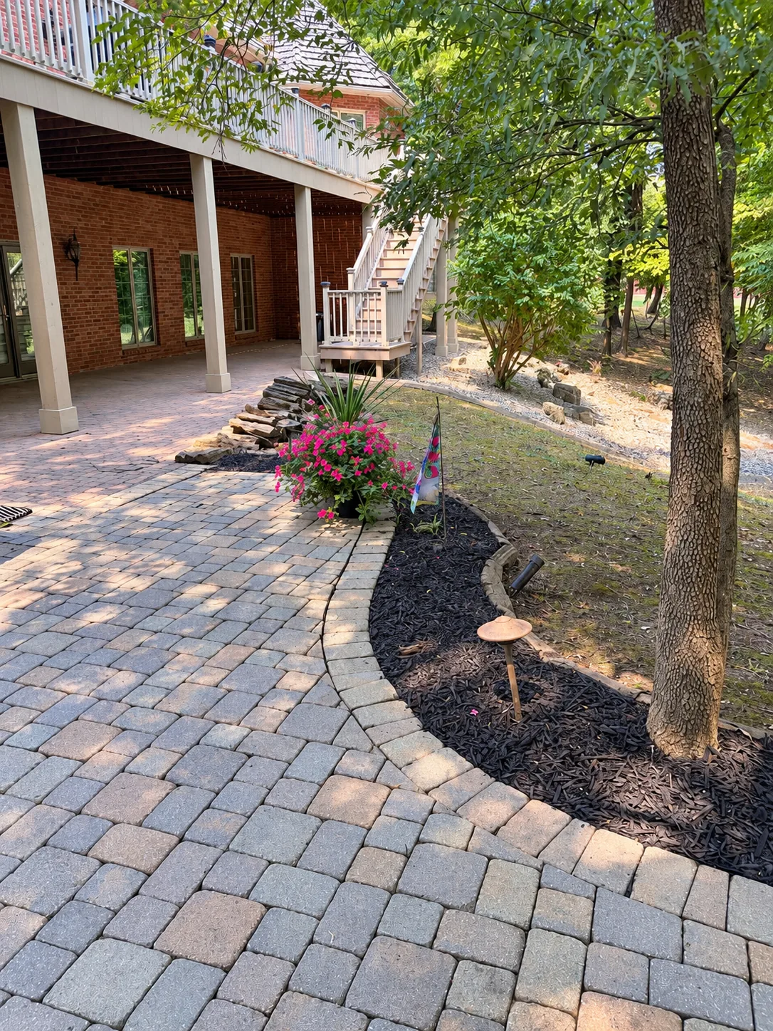 Paver walkway and mulched planting bed