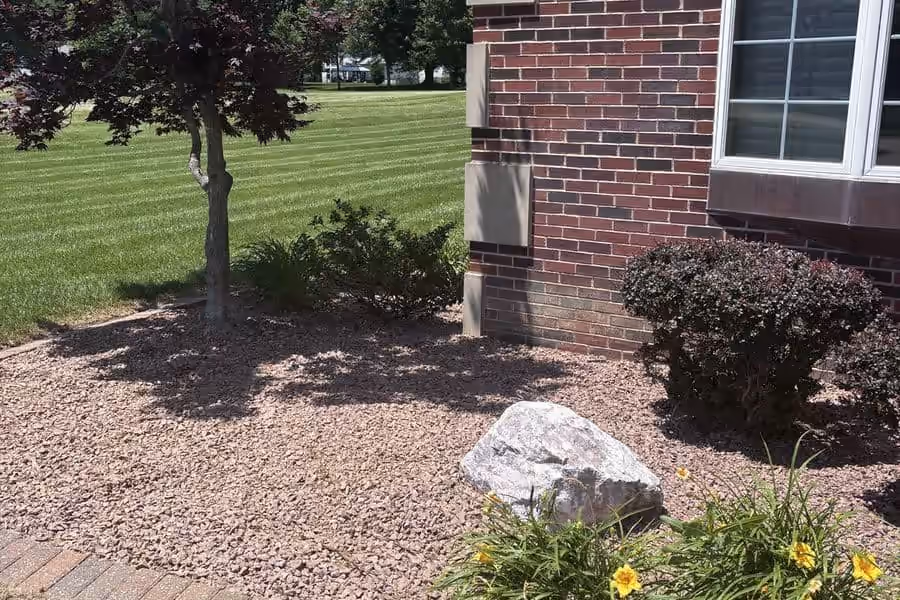 Rock bed landscape detail after cleanup in Metro East Illinois